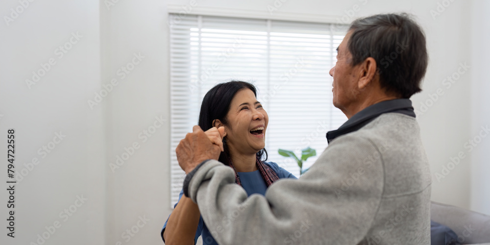 Holding hands, hug or happy old couple dancing for love, support or trust in marriage at home together Holding hands, hug or happy old couple dancing for love, support or trust in marriage at home together