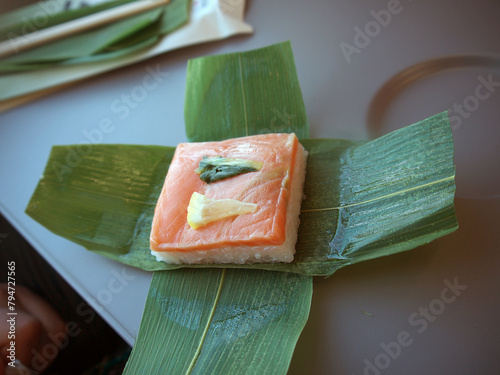 Sake oshizushi or Salmon pressed sushi wrapped in bamboo leaf, train catering food photo