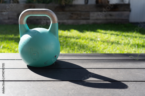 Kettlebell weight in backyard for getting fit and strong