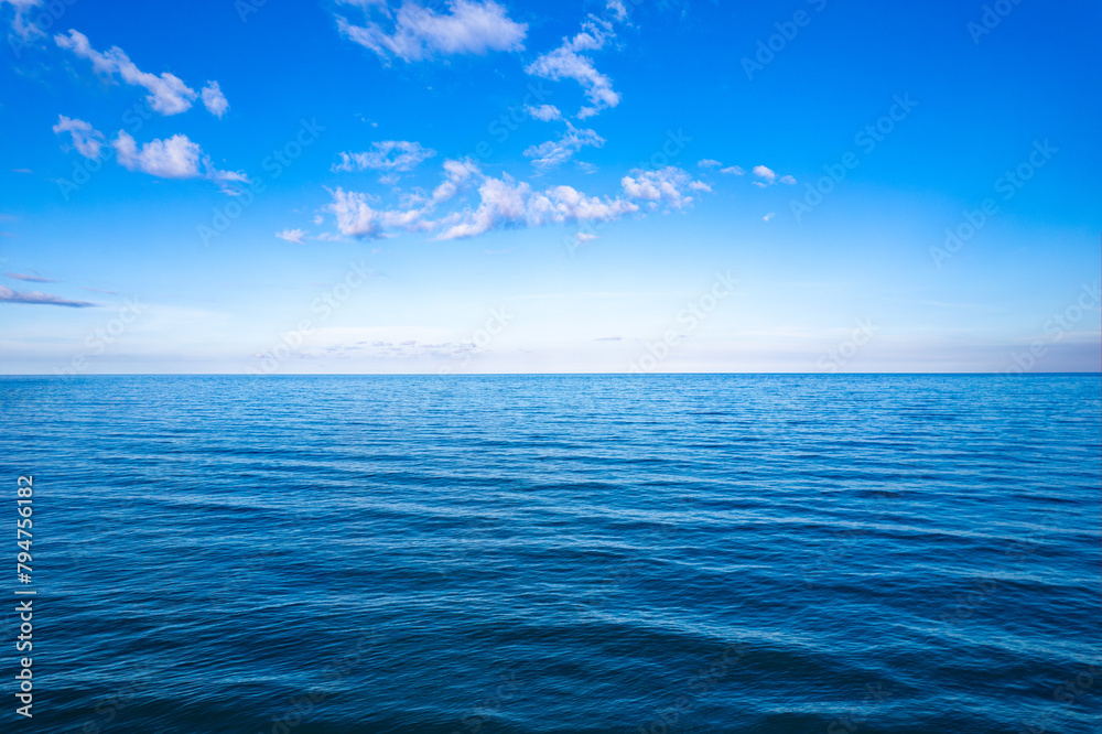 Ocean sea background and the clear sky For summer vacation ideas Nature of summer sea water with sunlight The sea sparkles against the blue sky	