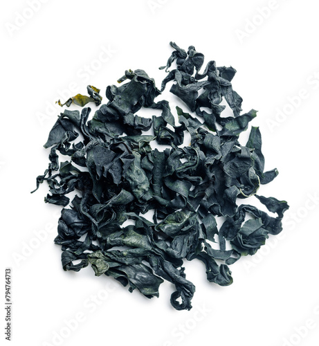 Dried wakame seaweed isolated on white background.