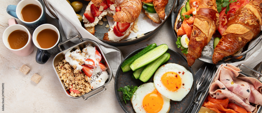 Large selection of breakfast food on a table. Large selection of breakfast food on a table.