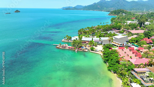 Εκτύπωση καμβά Turquoise waters, beachfront resorts, tropical mountains, and a clear blue sky create a stunning natural vista