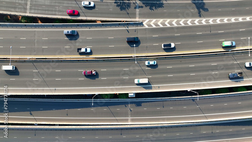 Aerial view, Drone surveys a vast highway expanse, emblematic of modern transport efficiency. Urban Mobility and Autonomous Vehicles concept. Bangkok, Thailand.

