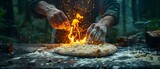 Chef expertly tosses pizza dough in lush forest with roaring fire. Concept Outdoor Cooking, Pizza Making, Food Preparation, Nature Setting, Culinary Skills