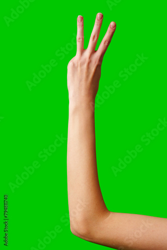 Human Hand Displaying the Number Three Against a Solid Green Background