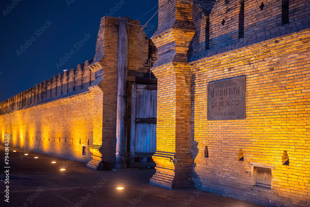the light on the street Tha Phae Gate Chiang Mai old city ancient wall and most popular travel destination and attraction for tourist in Chiang Mai Northern Thailand.night time