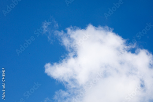 white clouds on the background of the blue sky