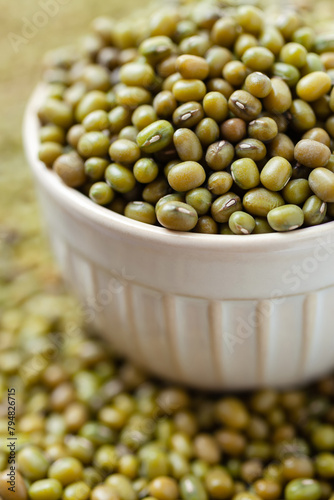 Uncooked, green mung beans in bowl. Dry mung beans grains