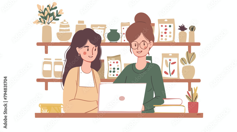 Successful female ceramists using a laptop together 