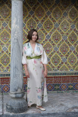 Tourist woman, fashion girl and Wat Ratchabophit in Bangkok city, Thailand. Religious traditional national Thai architecture. Landmark, architectural monument. Buddhist temple, sight