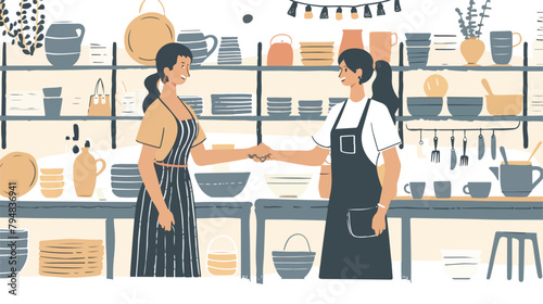 Two female ceramists shaking hands in a ceramic shop photo