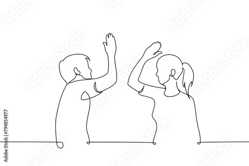 man and woman high five each other - one line art vector. concept  solidarity, heterosexual couple, high five deal
