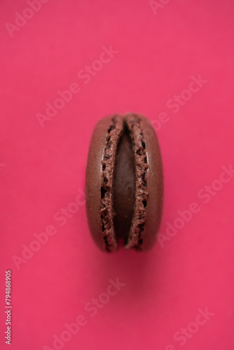 Colorful macaroon on a pink background. Top view.