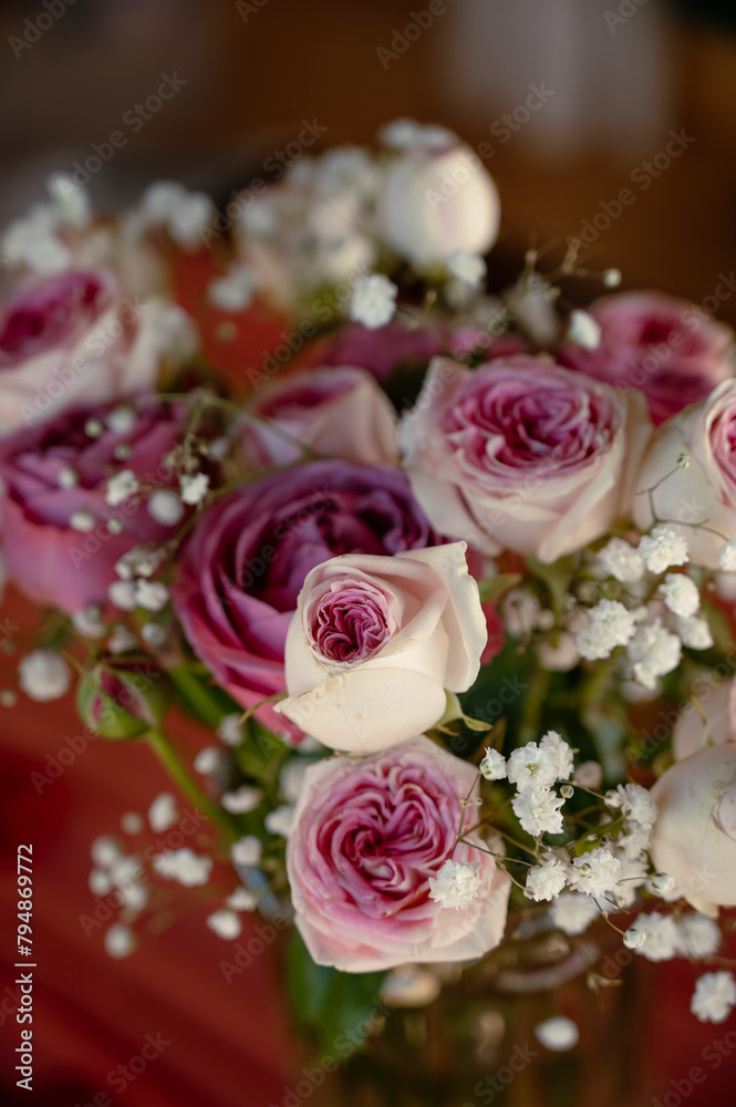 A bouquet of pink roses on the table. Bouquet for a date A bouquet of pink roses on the table. Bouquet for a date