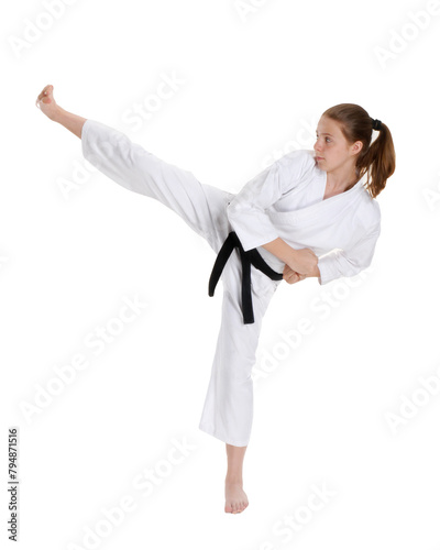 Female Karate kid kicking isolated on transparent layered background.