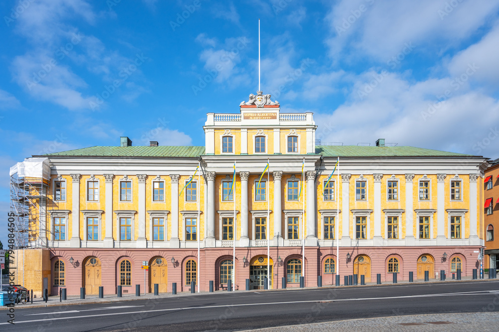 Fototapeta premium The Palace of the Hereditary Prince, Swedish: Arvfurstens Palats, stands bathed in sunlight, showcasing its elegant facade and classic architecture at the Gustav Adolfs Torg in Stockholm, Sweden
