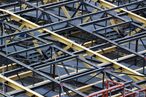 Steel trusses and beams of an unfinished roof, construction site background photo
