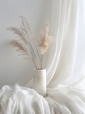 Boho backdrop , Single dried pampas grass stem placed inside a textured white vase. 