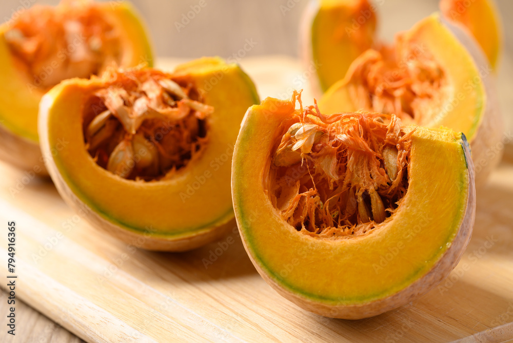 Organic pumpkin on cutting wooden board, Food ingredient Organic pumpkin on cutting wooden board, Food ingredient