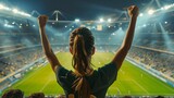 female fans celebrating victory in football stadium.