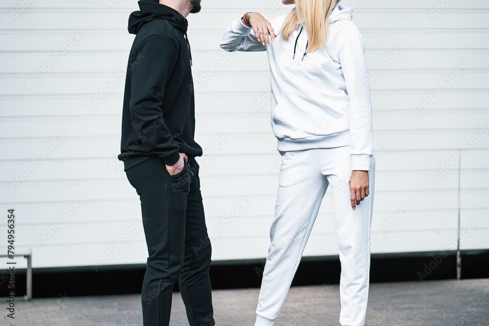 Fototapeta premium Woman and Man wear a sweatshirt hoodie. Isolated close-up of streetwear apparel. Hoodies mockup.