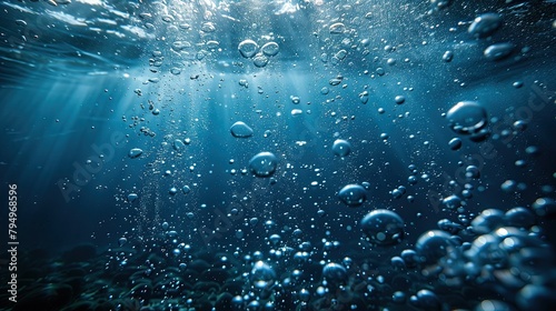 Close-up of submerged air bubbles rising to the surface. on a dark background