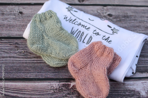Small gift for newborn baby, soft knitted socks and bodysuit