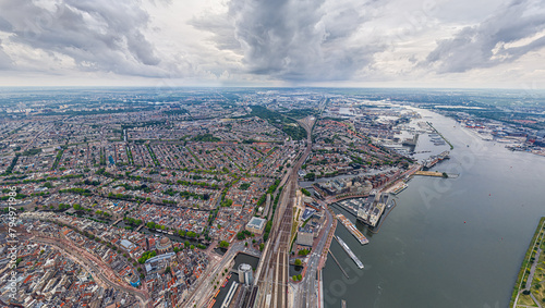 Amsterdam, Netherlands. Panorama of the city on a summer morning in cloudy weather. Aerial view