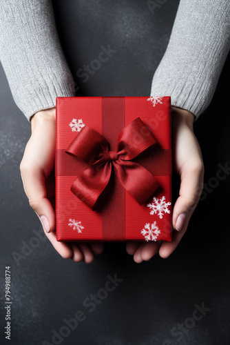 Christmas card template. Happy New year backdrop. Beautiful gift box in hands..