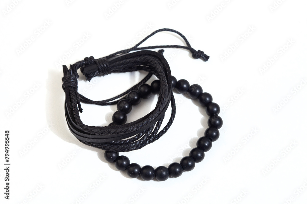 Obraz premium Black male leather bracelets isolated on white