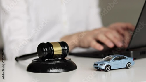 Car Accident Liability Insurance Lawyer And Gavel. Lawyer using laptop. photo