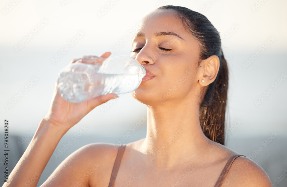Woman, athlete and drinking water outdoors, thirsty and runner hydration after workout or cardio. Female person, detox and mineral liquid for recovery after exercise, fitness sports and nutrition Woman, athlete and drinking water outdoors, thirsty and runner hydration after workout or cardio. Female person, detox and mineral liquid for recovery after exercise, fitness sports and nutrition