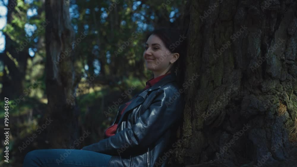 Young female in the forest alone. Sunny day. cinematic. Young female in the forest alone. Sunny day. cinematic.