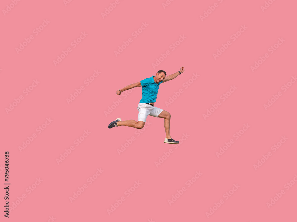 man in jumpsuit in summer clothes on solid pink background, white shorts, latin beauty