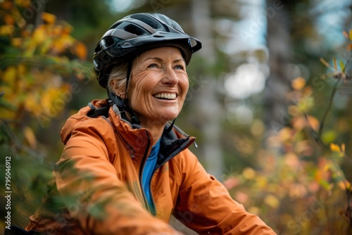 Senior Woman Enjoying Autumn Bike Ride in Nature - Active Lifestyle Concept