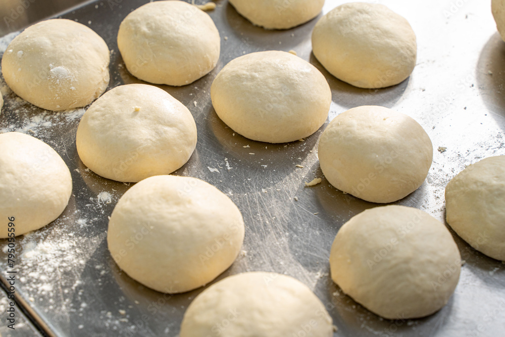 Dough blanks for baking bread on the production table. Selected focus. Dough blanks for baking bread on the production table. Selected focus.
