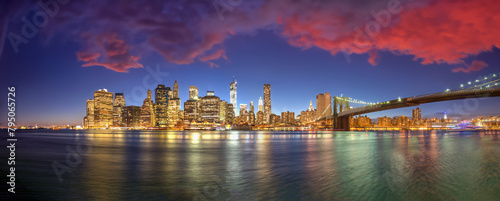 New York City night lights. Lower Manhattan and Brooklyn Bridge panorama from Brooklyn Bridge Park