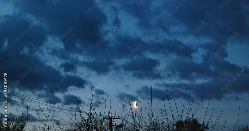 Crescent Moon on Dark Blue Cloudy Sky. Morning Evening 4K 10-bit Crescent Moon on Dark Blue Cloudy Sky. Morning Evening 4K 10-bit