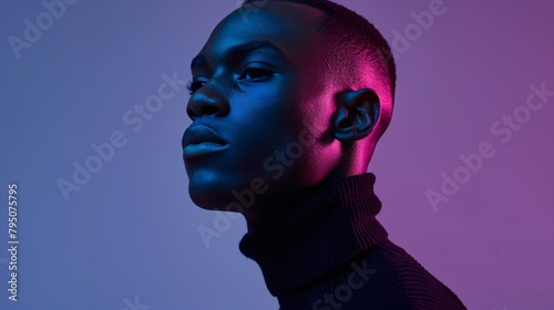 a man with black hair and purple and blue light photo