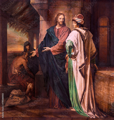 MILAN, ITALY - MARCH 8, 2024: The painting of Christ and Rich Young Ruler in the church Chiesa di Santi Quattro Evangelisti by Ahtos Renzo Brioschi as the copy of by Heinrich Hofmann (1889).
