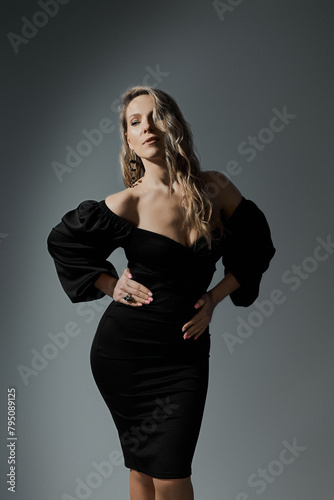 Elegant Blonde Woman in Little Black Fashion Dress