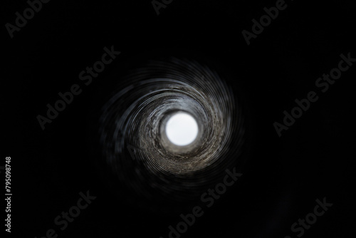 Close-Up View Inside a Gun Barrel Revealing the Rifling Spiral Pattern