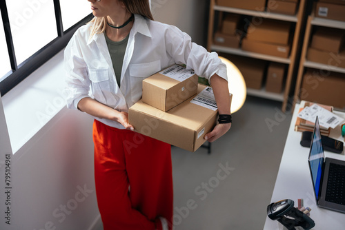 Woman holding parcels ready for shipment
