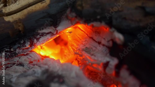embers in campfire in summer