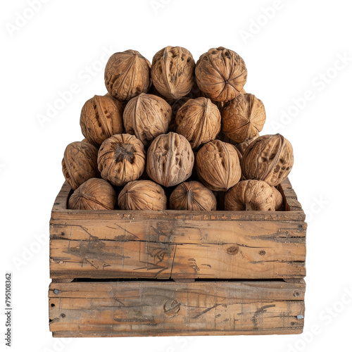 At the center of a wooden box a pyramid of whole walnuts stands alone against a transparent background exuding a sense of mystery and elegance photo