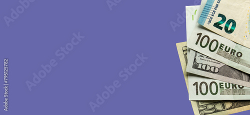 Euro and dollar banknotes on a blue banner background. Cash in euros. Conceptual background for design with copy space.

