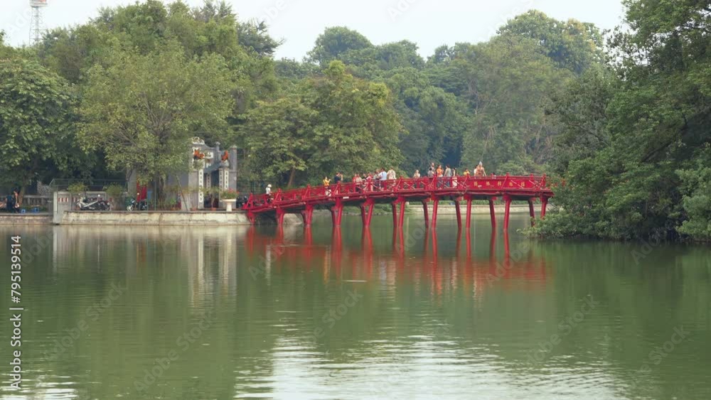 Hanoi, Vietnam - August 23, 2023: The Huc Bridge (Welcoming Morning Sunlight Bridge) in Hoan Kiem Lake Hanoi, Vietnam - August 23, 2023: The Huc Bridge (Welcoming Morning Sunlight Bridge) in Hoan Kiem Lake