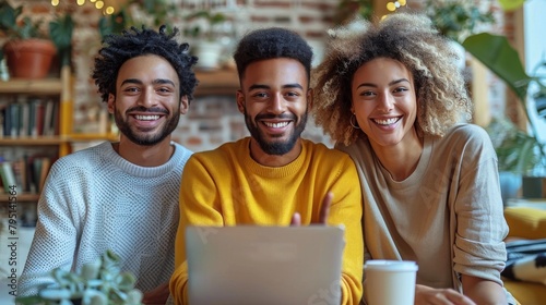Group of People Sitting at Table With Laptop