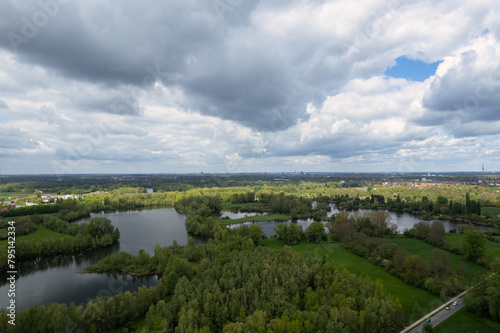 Cloudy sky over a lake surrounded by trees in a natural landscape Hanover Germany